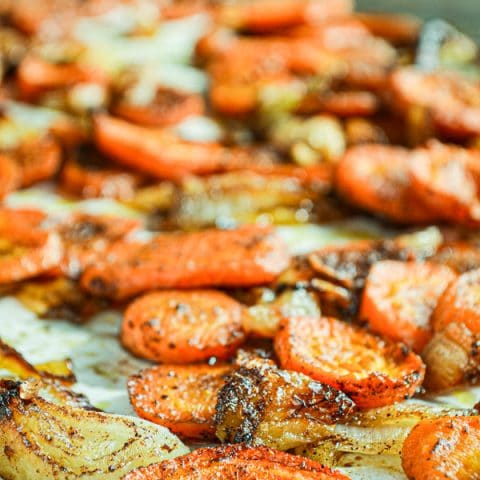 The humble carrot is roasted with onions and sprinkled with a brown sugar and cinnamon mixture for a delicious result!