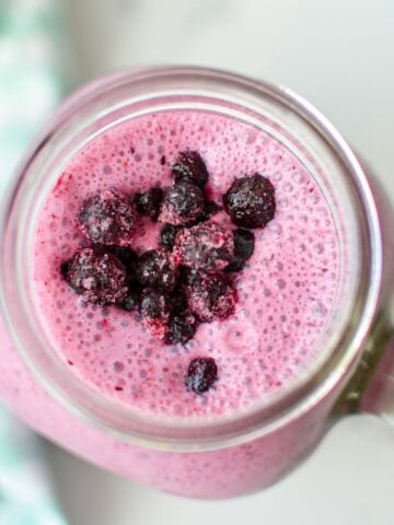 An overhead shot of a blueberry kefir smoothie