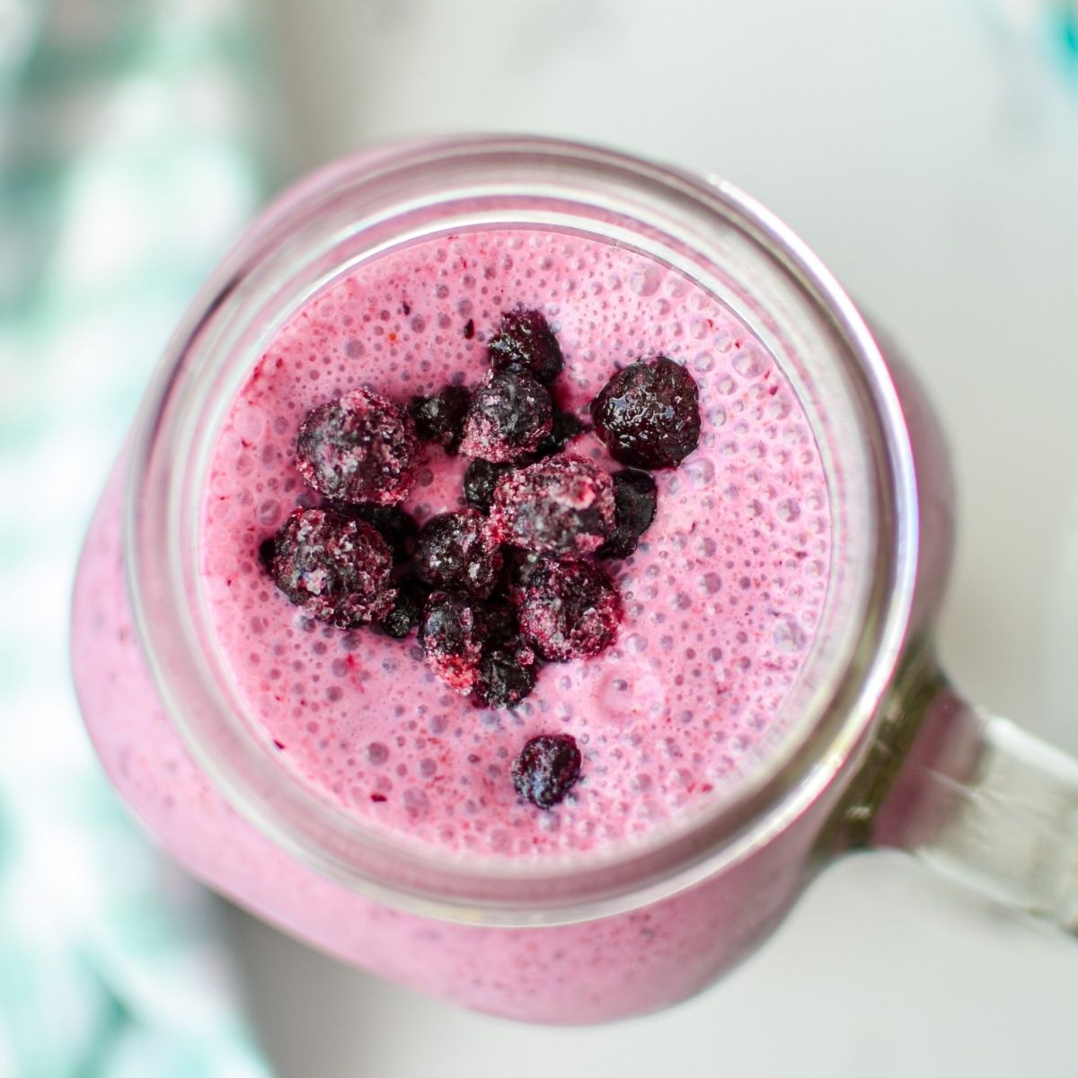 An overhead shot of a blueberry kefir smoothie