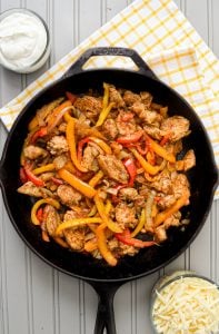 Make these delicious, veggie-packed Skillet Chicken Fajitas NOW! They'll soon be a weekly favorite! So easy and so delicious!