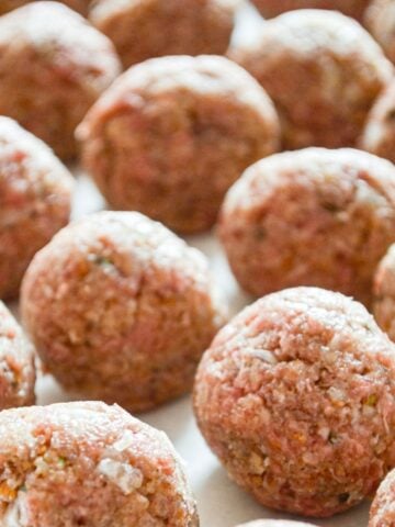 A tray full of freezer meatballs.