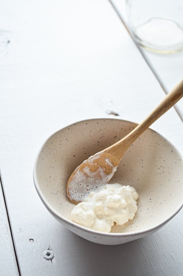 Milk kefir grains are an essential element of making milk kefir at home. Here you see the cauliflower-like grains in a small bowl. These will ferment your milk into kefir.
