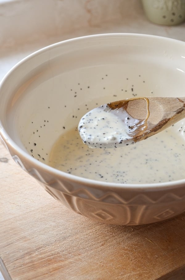 A bowl of healthy honey sweetened poppy seed salad dressing.