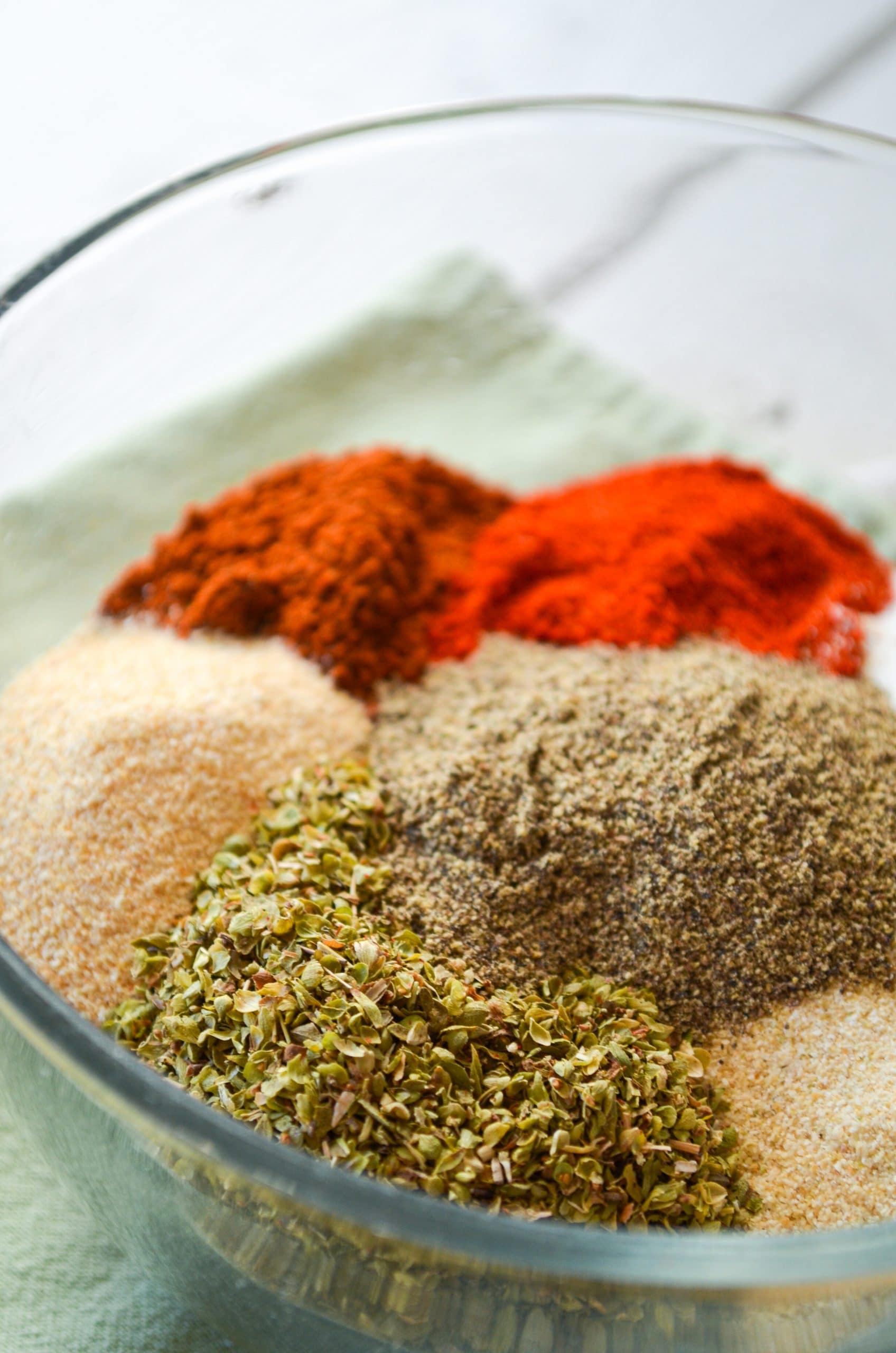 A bowl of various seasonings; ingredients for chicken taco seasoning.