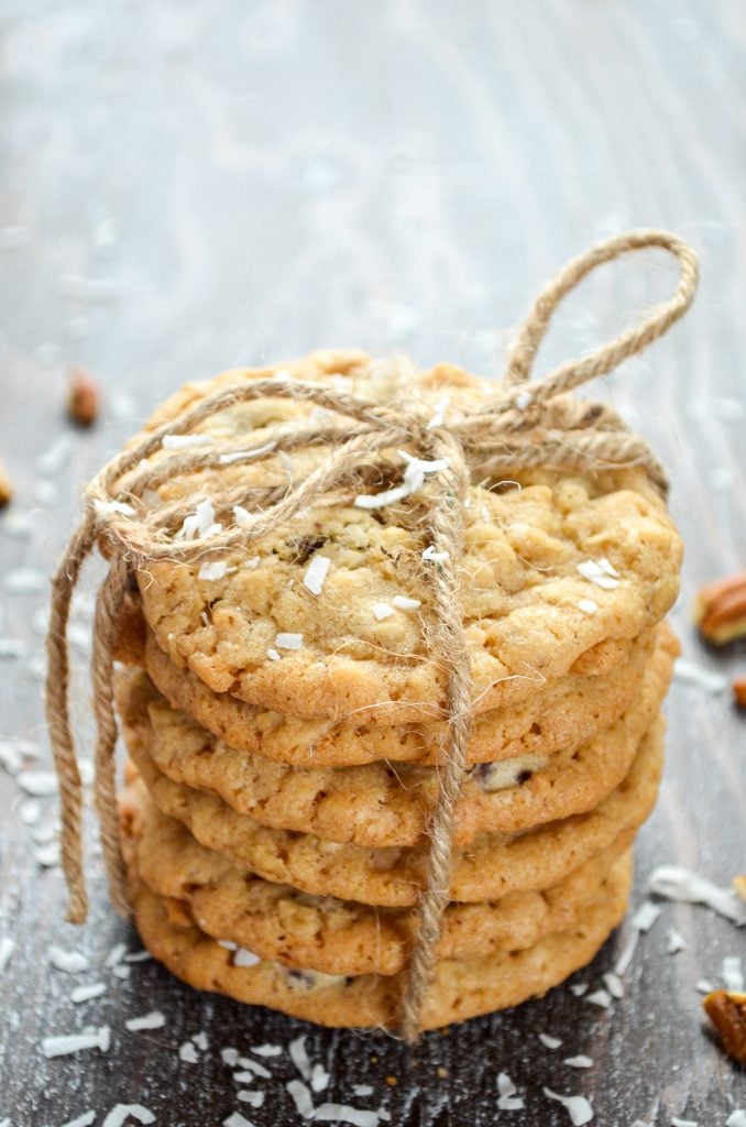 6 cookies stacked and wrapped in twine. Coconut and pecans sprinkled around.