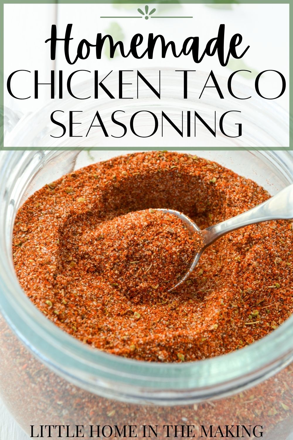 A jar of homemade seasoning; a spoon removing a portion of it.