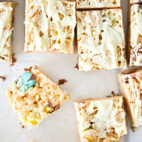 A top view of easter rice krispie squares, drizzled with white chocolate.