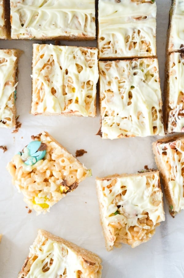 A top view of easter rice krispie squares, drizzled with white chocolate.