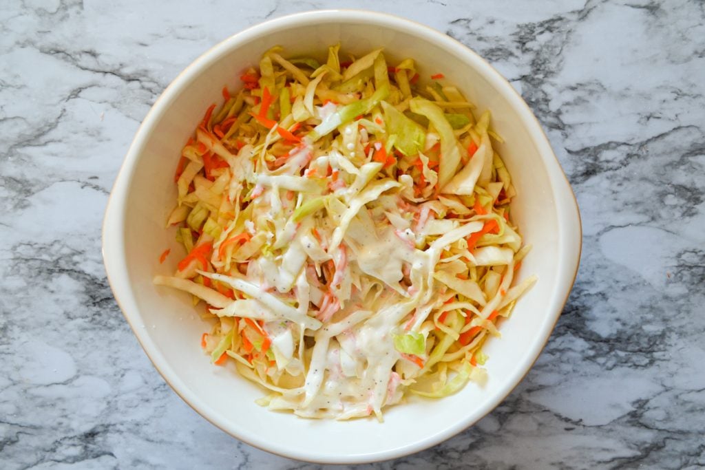 A bowl of coleslaw, with buttermilk coleslaw dressing added in.
