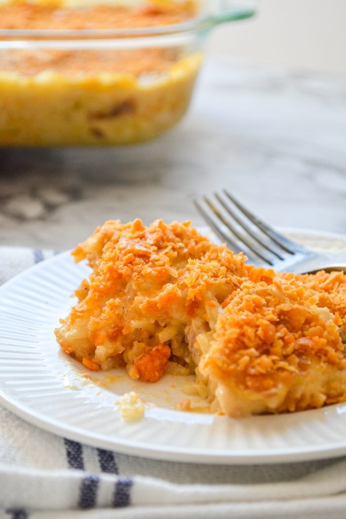 Chicken and rice casserole on a small white plate.