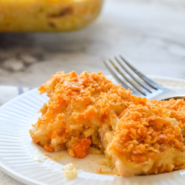 Chicken and rice casserole on a small white plate.