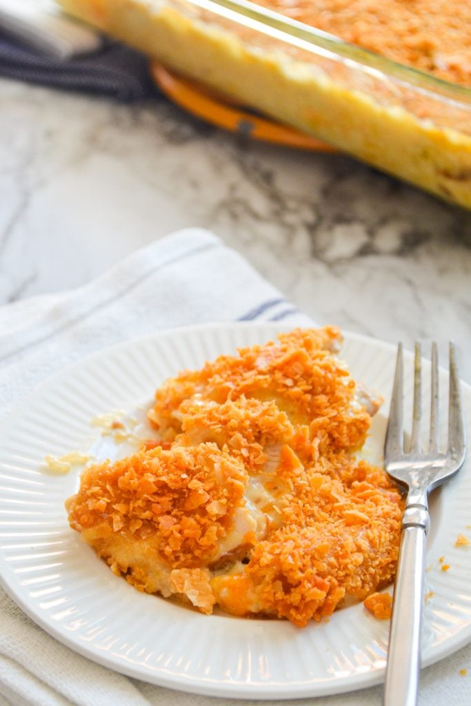 A serving of chicken divine casserole on a small white plate.