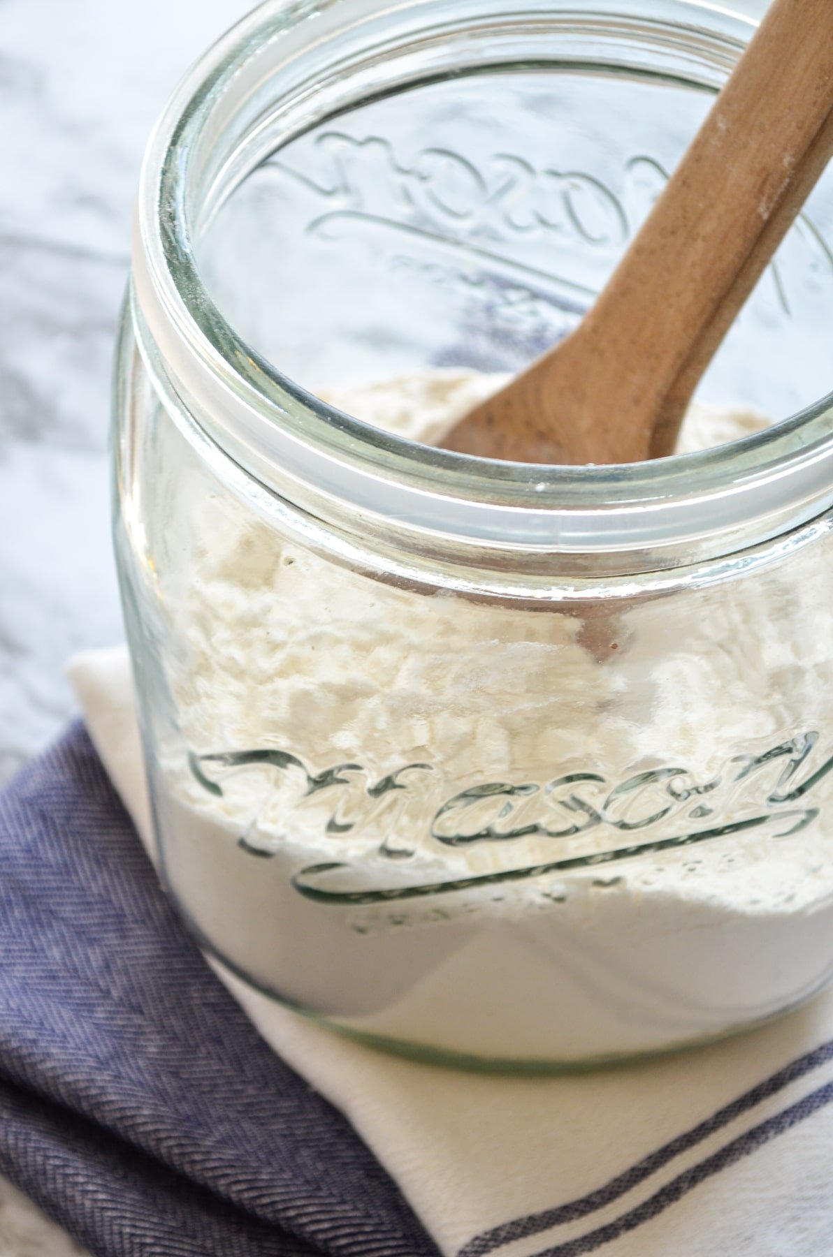 Bread flour in a large glass canister.