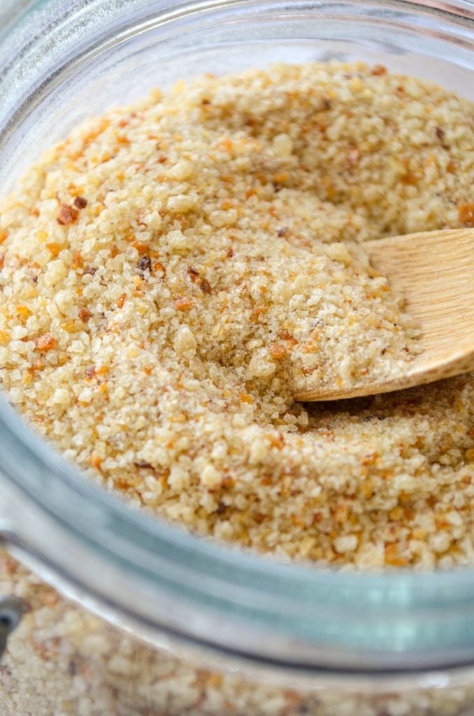 Sourdough breadcrumbs made from leftover sourdough bread. Crushed and in a small jar with a small wooden spoon inside.