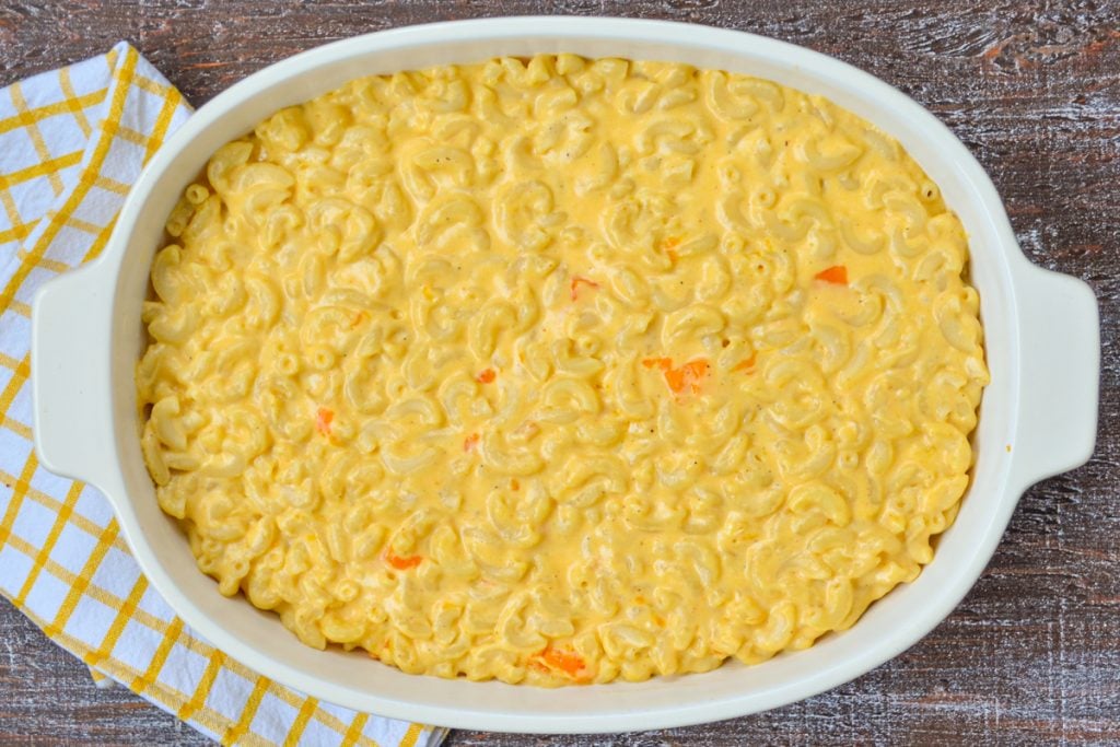 An overhead view of an unbaked macaroni and cheese, made from scratch.