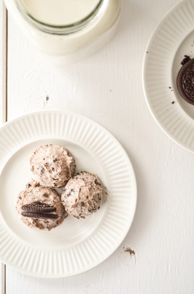 An overhead shot of oreo cheesecake bites on a white plate.