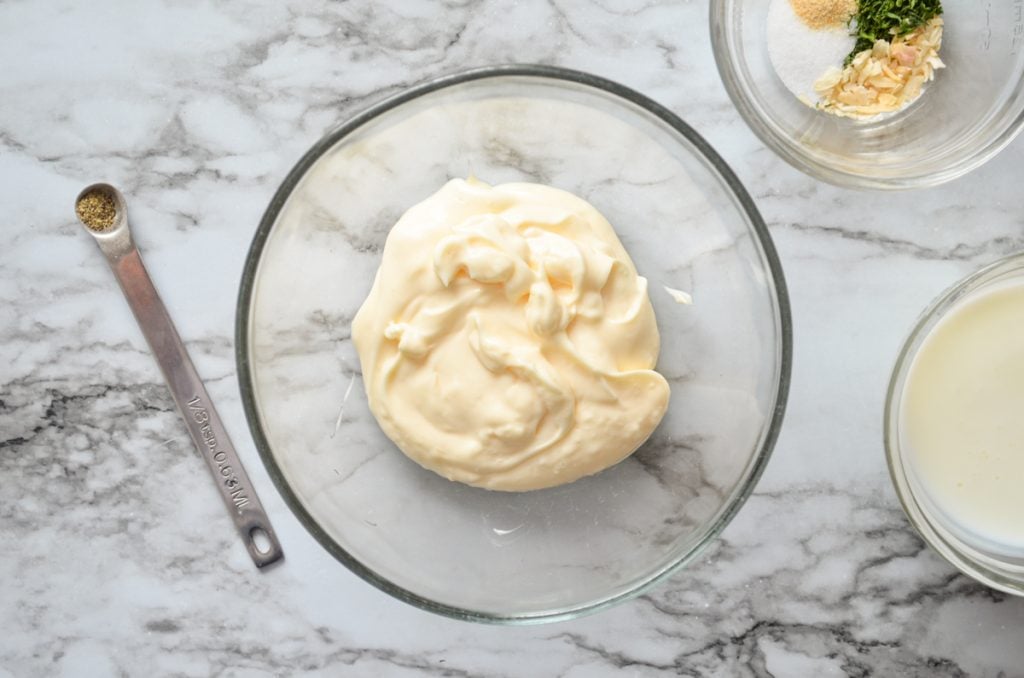 The ingredients needed to make buttermilk ranch dressing from scratch.