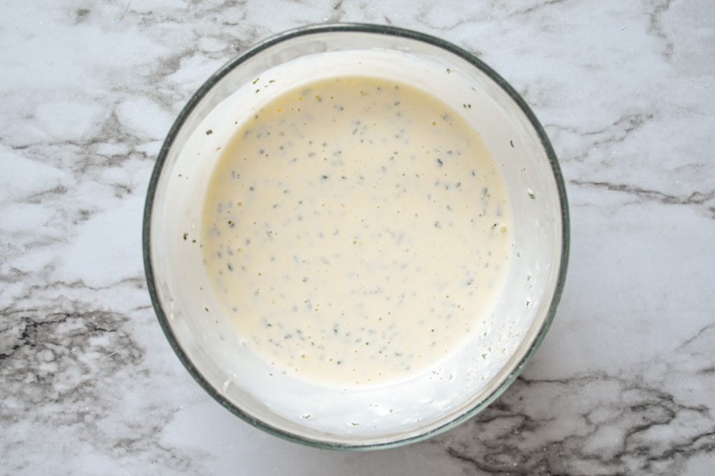 A bowl of buttermilk ranch dressing made from scratch.