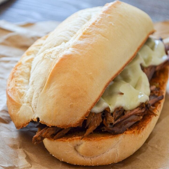 A french dip sandwich on butcher paper.