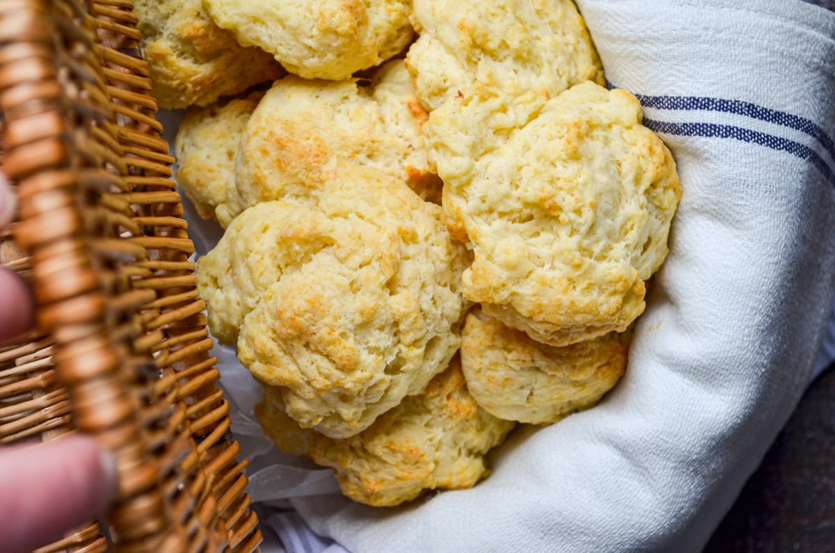 A basket full of sourdough drop biscuits.