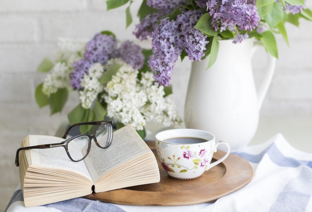 A warm cup of tea or coffee and a book.