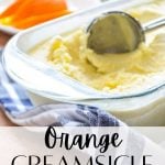 A glass dish filled with orange creamsicle ice cream.