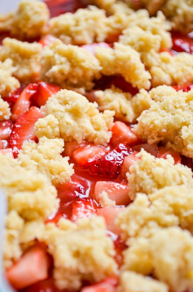 A close up of a crumb topping for strawberry bars.