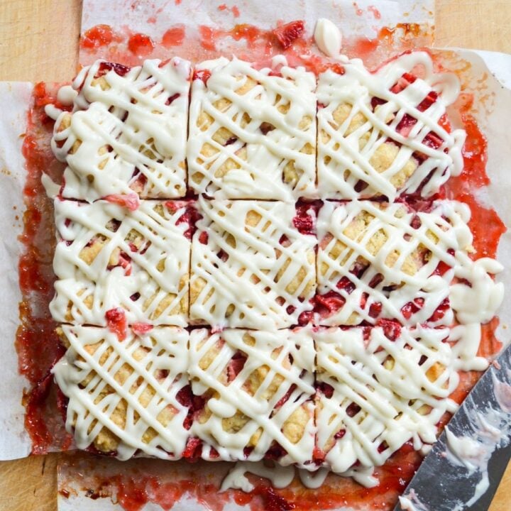 Strawberry oatmeal crumb bars, cut into squares.