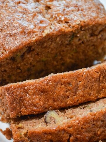 A loaf of sourdough zucchini bread, sliced into individual servings.