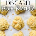Baked sourdough drop biscuits on a sheet pan.