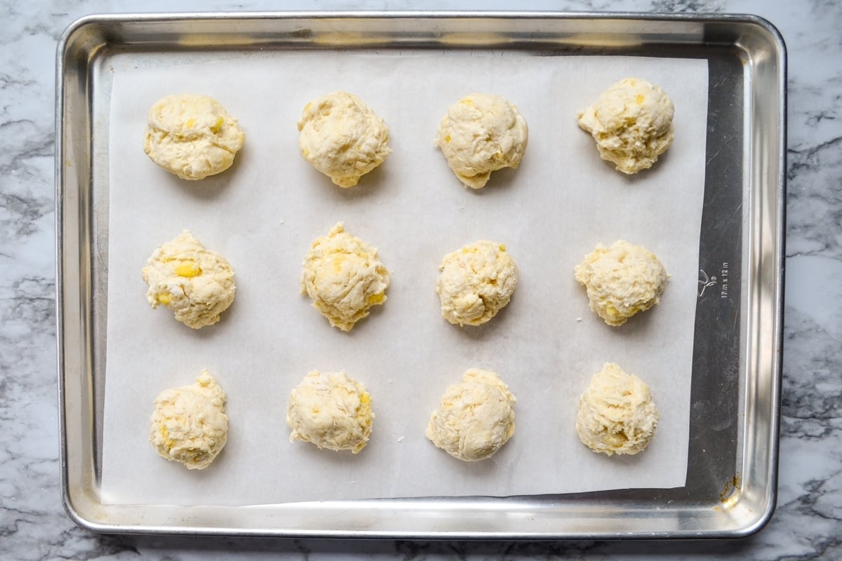 A baking sheet of drop biscuits.