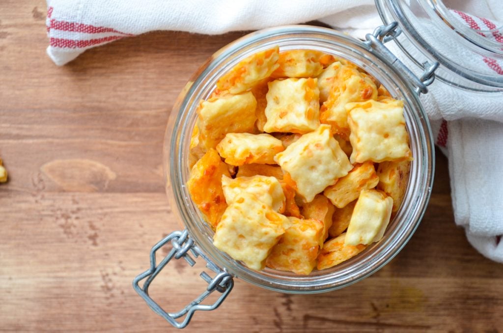 A jar of homemade sourdough cheese crackers