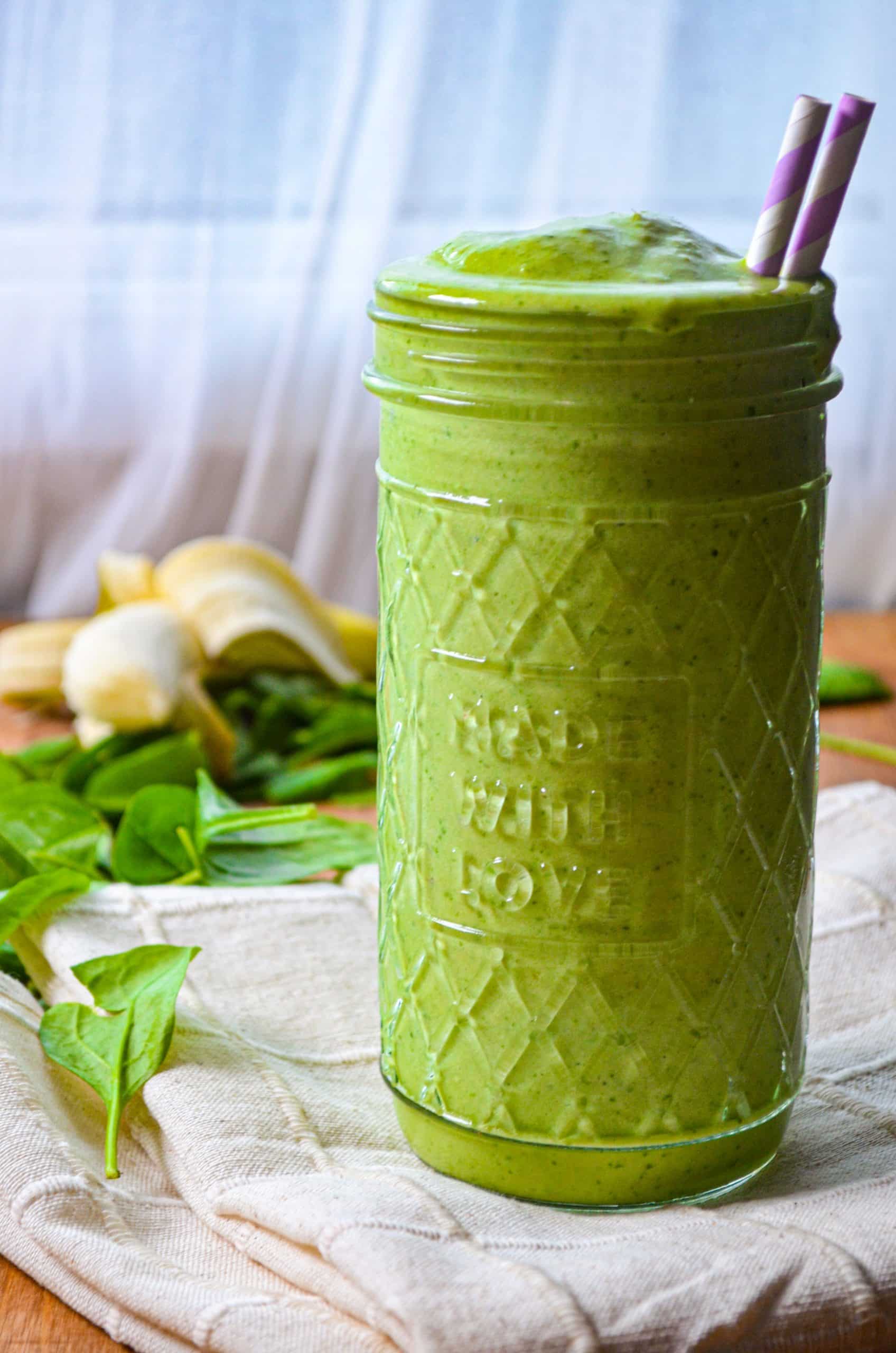 A large jar filled with a homemade kefir green smoothie.