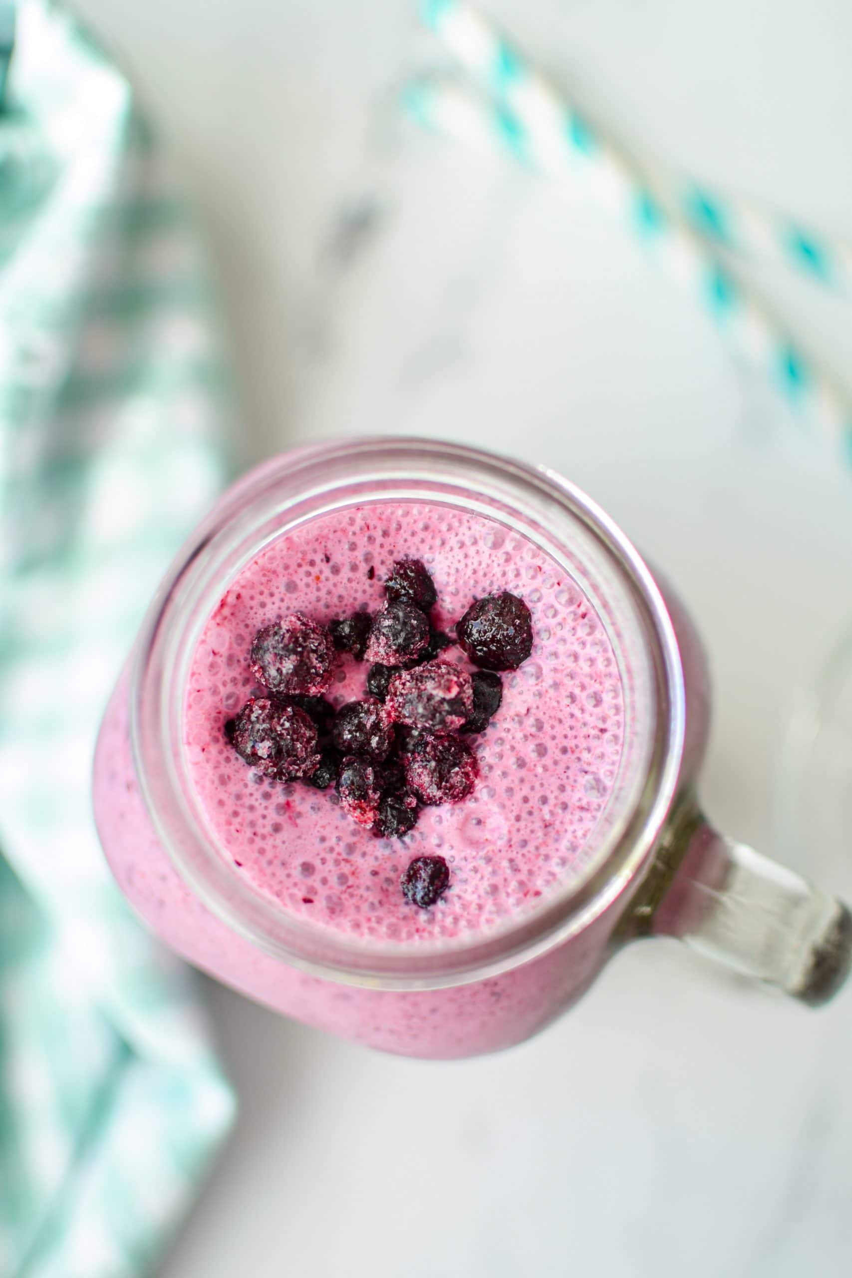 An overhead shot of a blueberry smoothie.