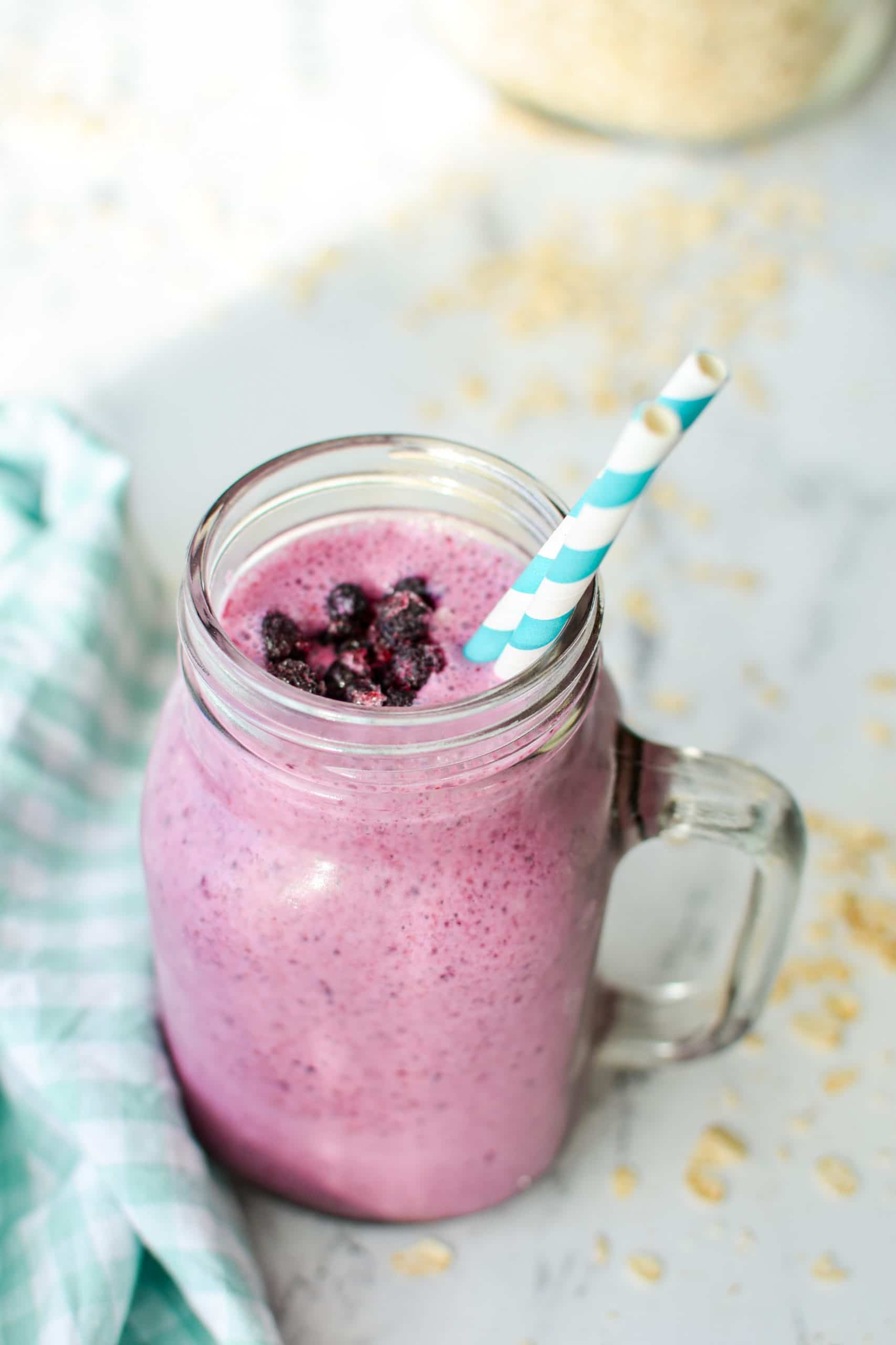 A jar style cup of blueberry kefir smoothie