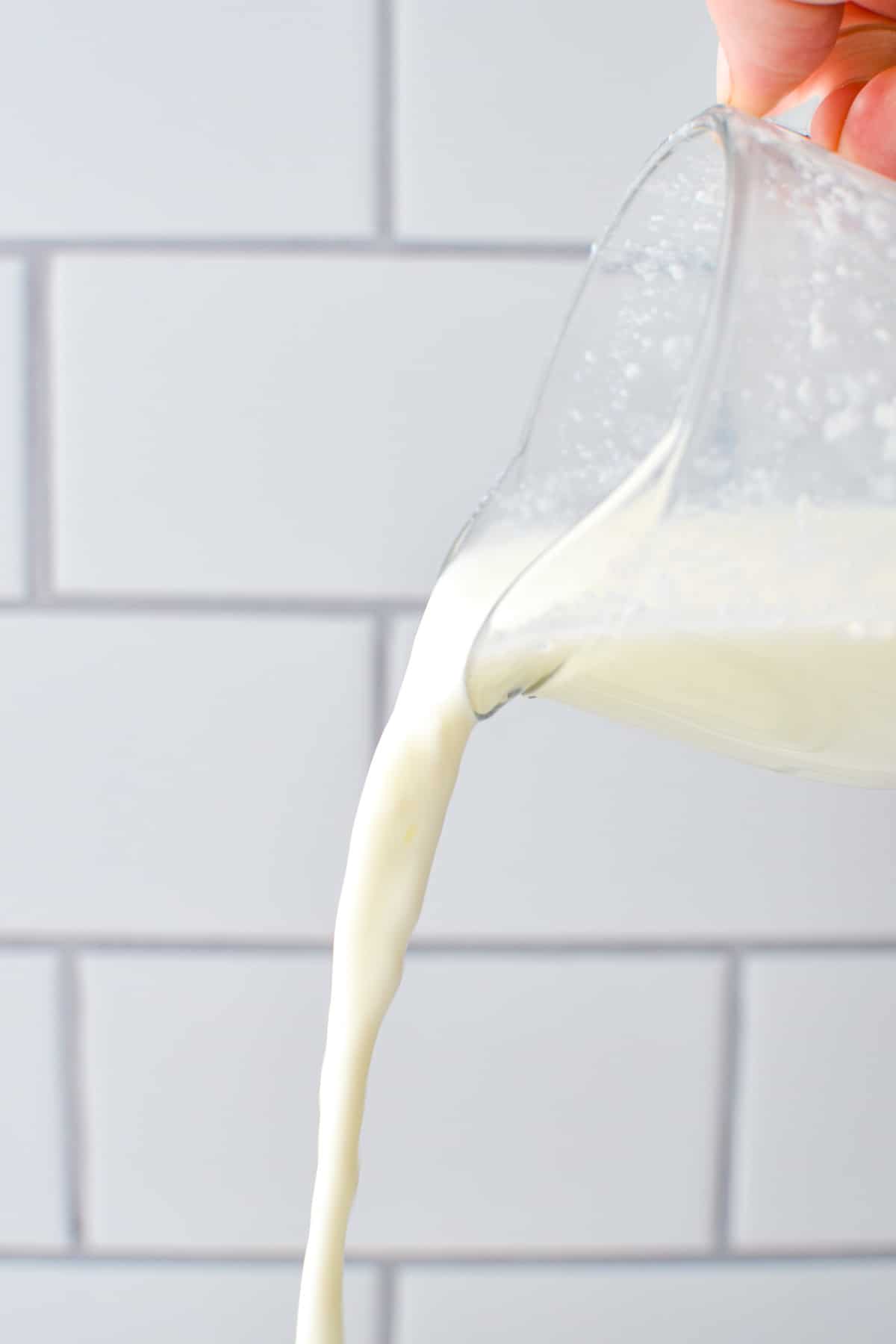 Buttermilk being poured into an imaginary dish