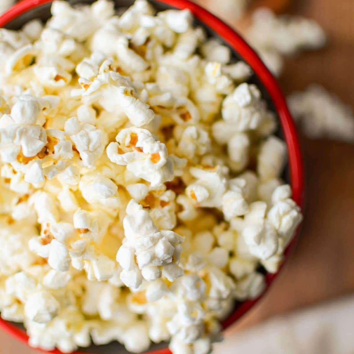 A close up of a container of popcorn.