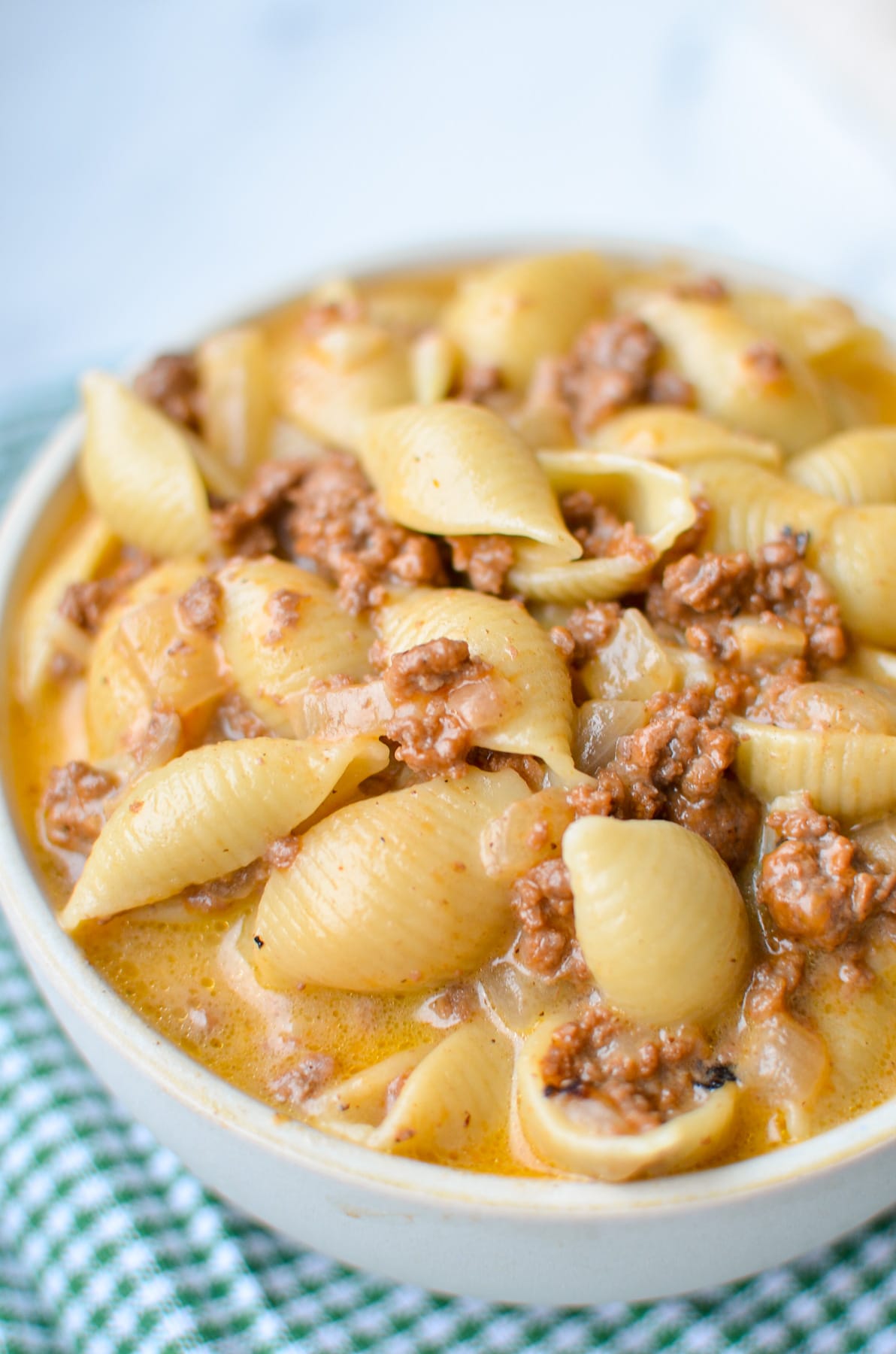A bowl of homemade hamburger helper with beef and pasta.