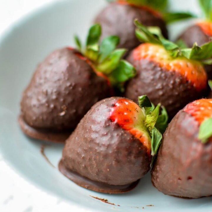 a plate of coconut oil chocolate covered strawberries