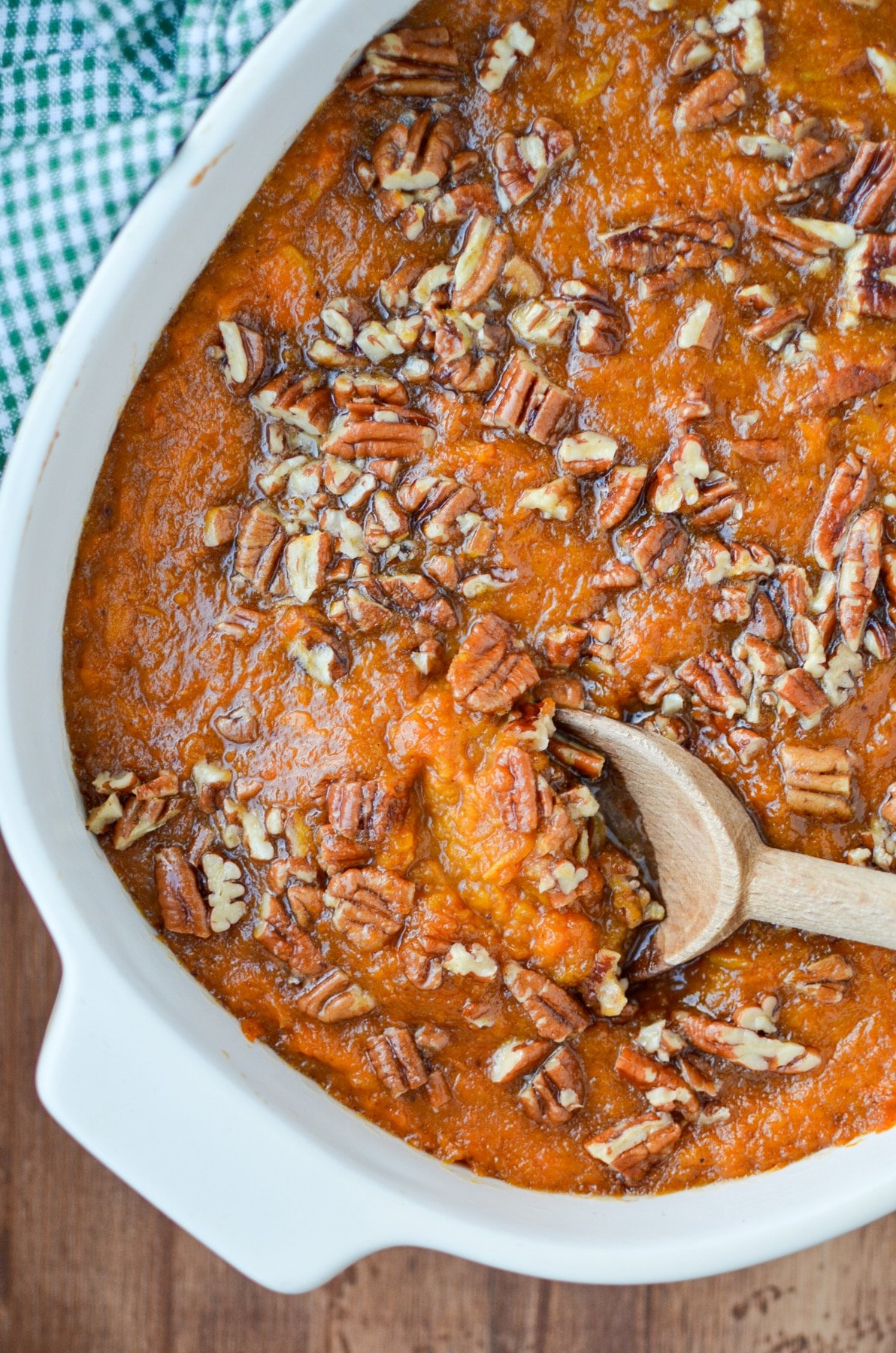 A spoon scooping out a portion of healthy sweet potato casserole