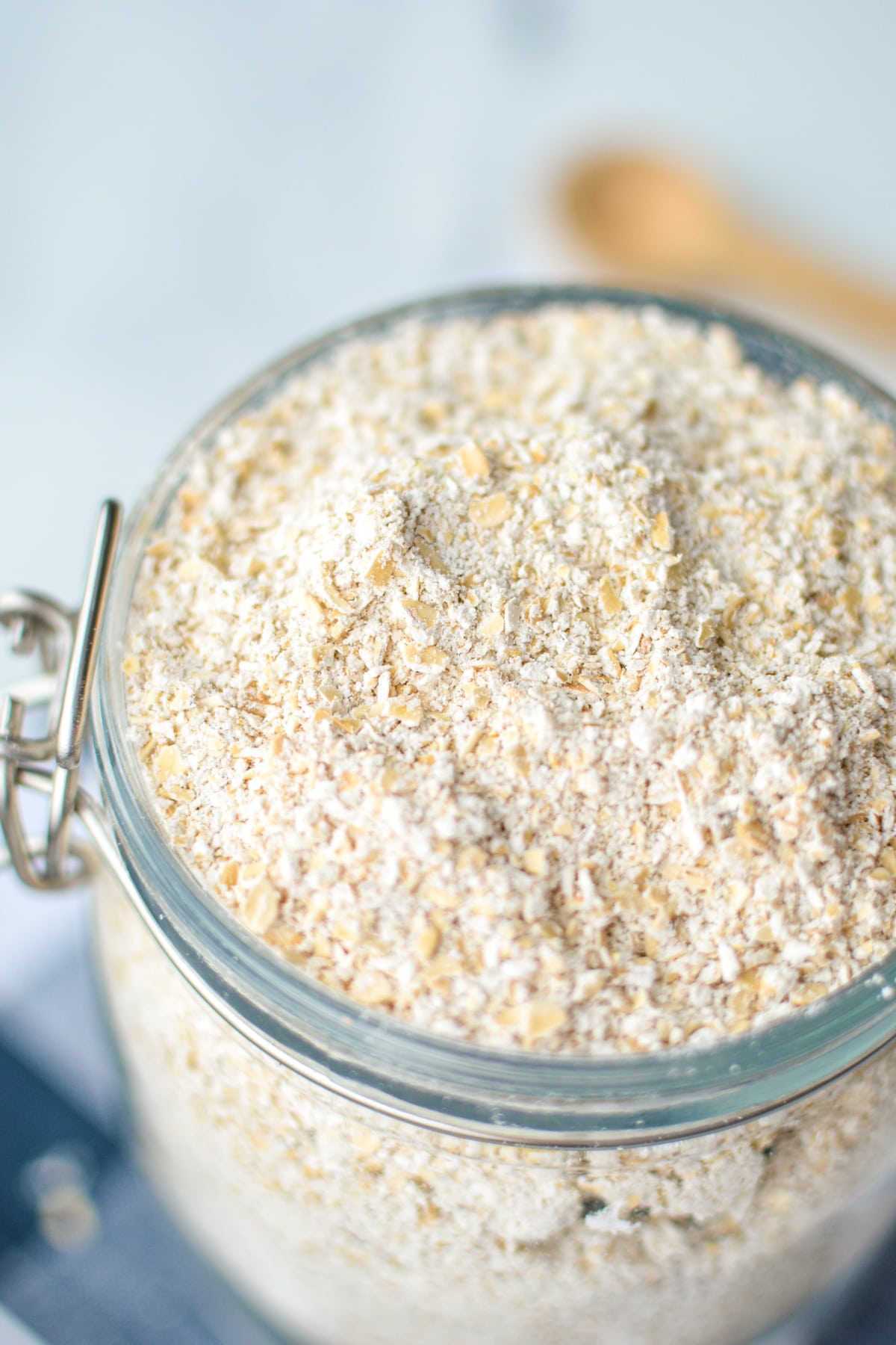 A close up of a container of homemade oat flour.