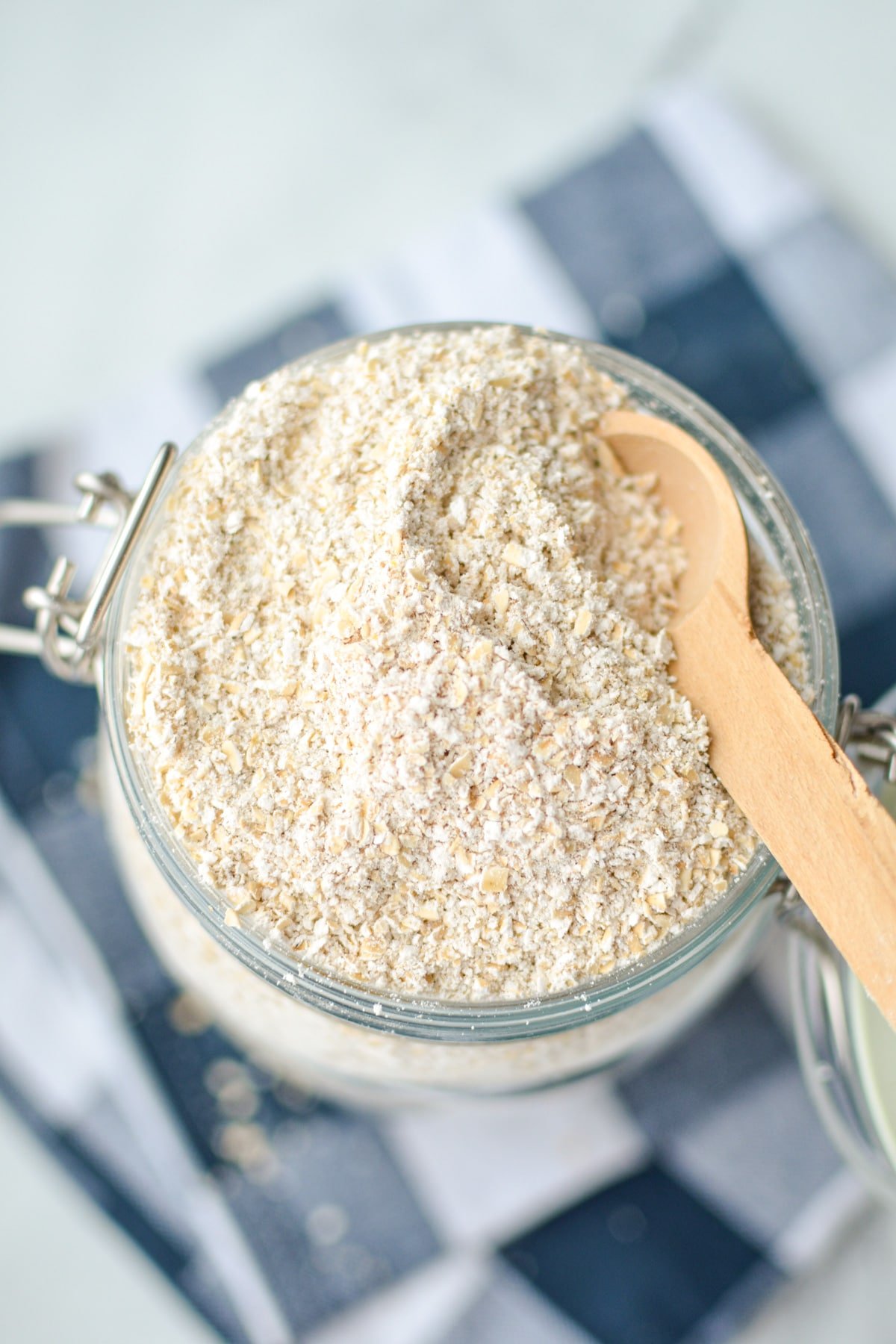 A jar filled with homemade sprouted oat flour