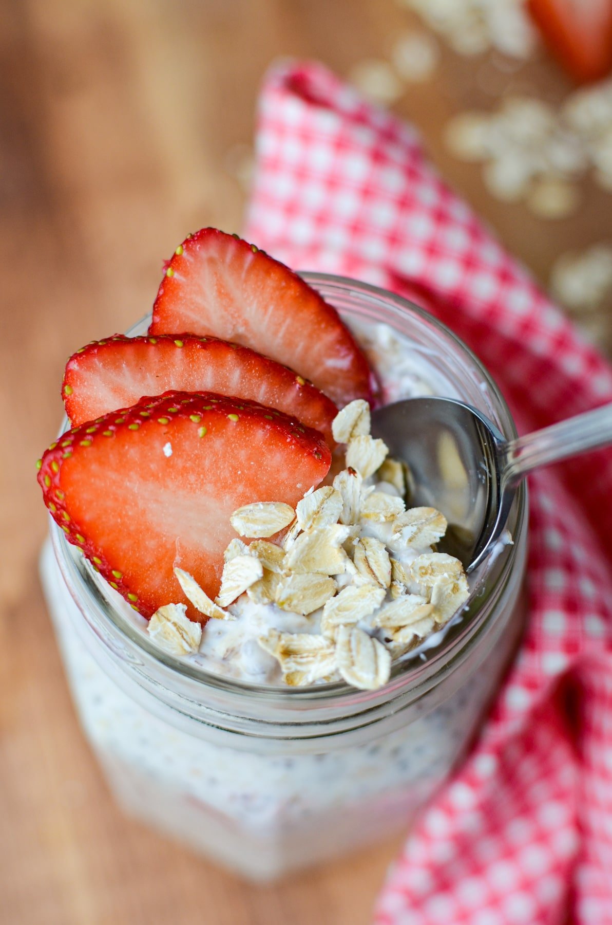 A jar of kefir overnight oats with strawberries