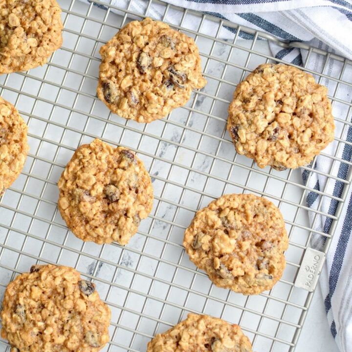 A cooling rack with sourdough oatmeal cookies on it.