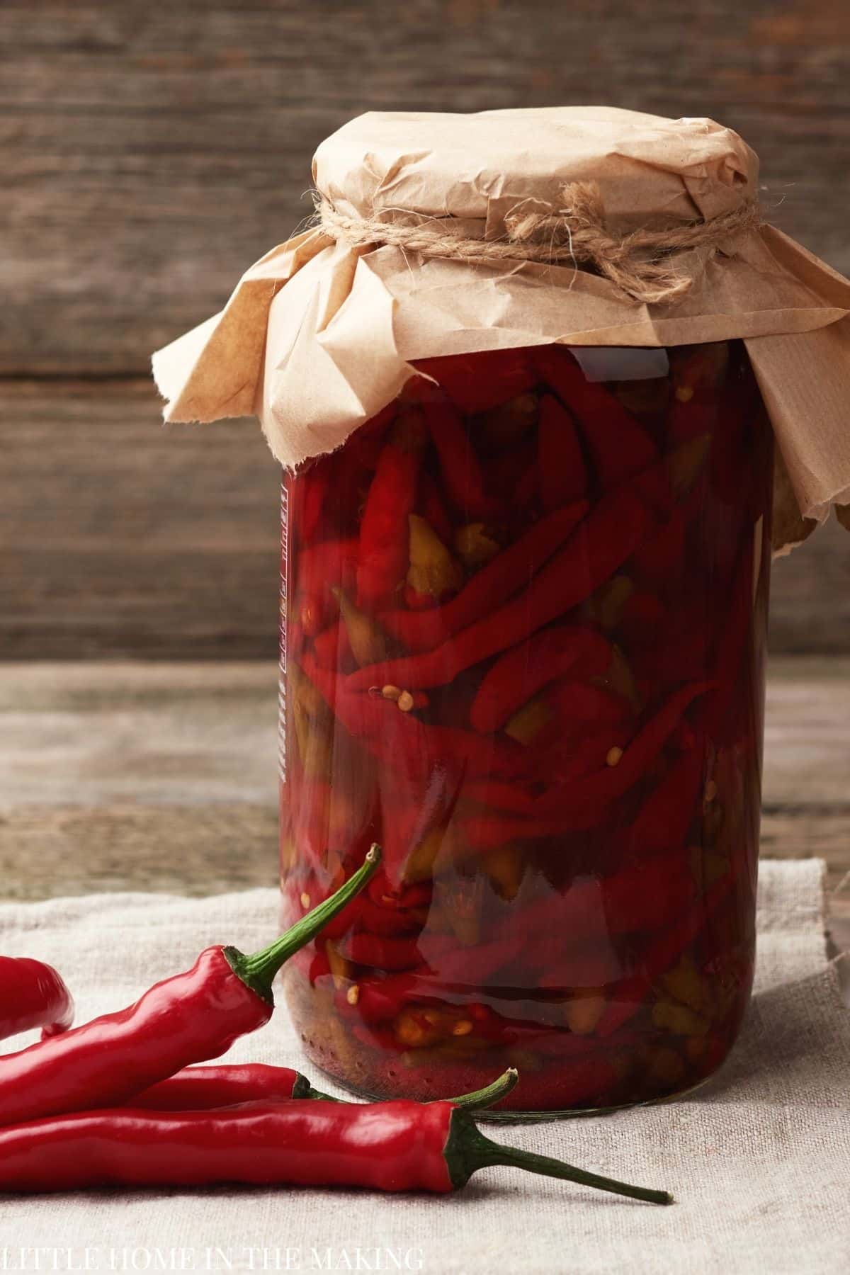 A jar of cayenne peppers getting fermented.