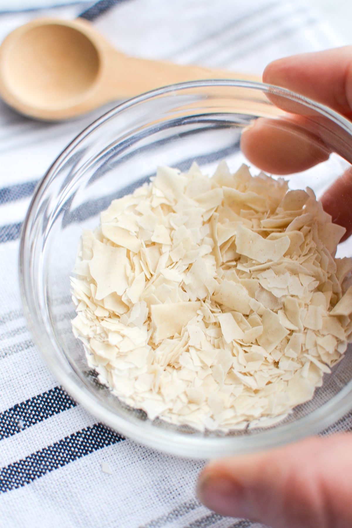 A small bowl with dried sourdough flakes inside.