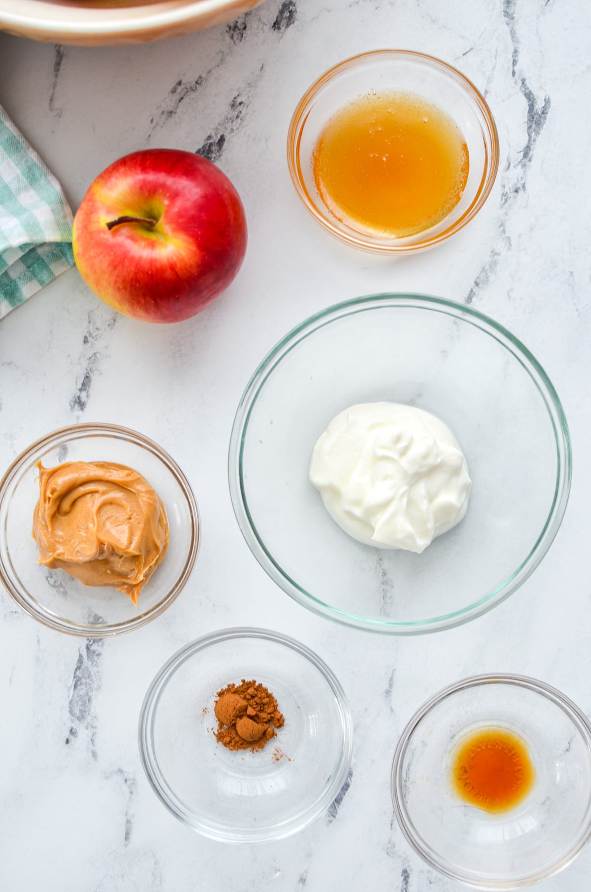 The ingredients needed to make a dip for apple slices.