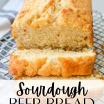 A loaf of sourdough beer bread, sliced on a cooling rack. The text overlay reads: sourdough beer bread recipe.