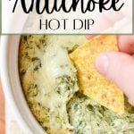 A chip dipping into a hot spinach and artichoke dip.