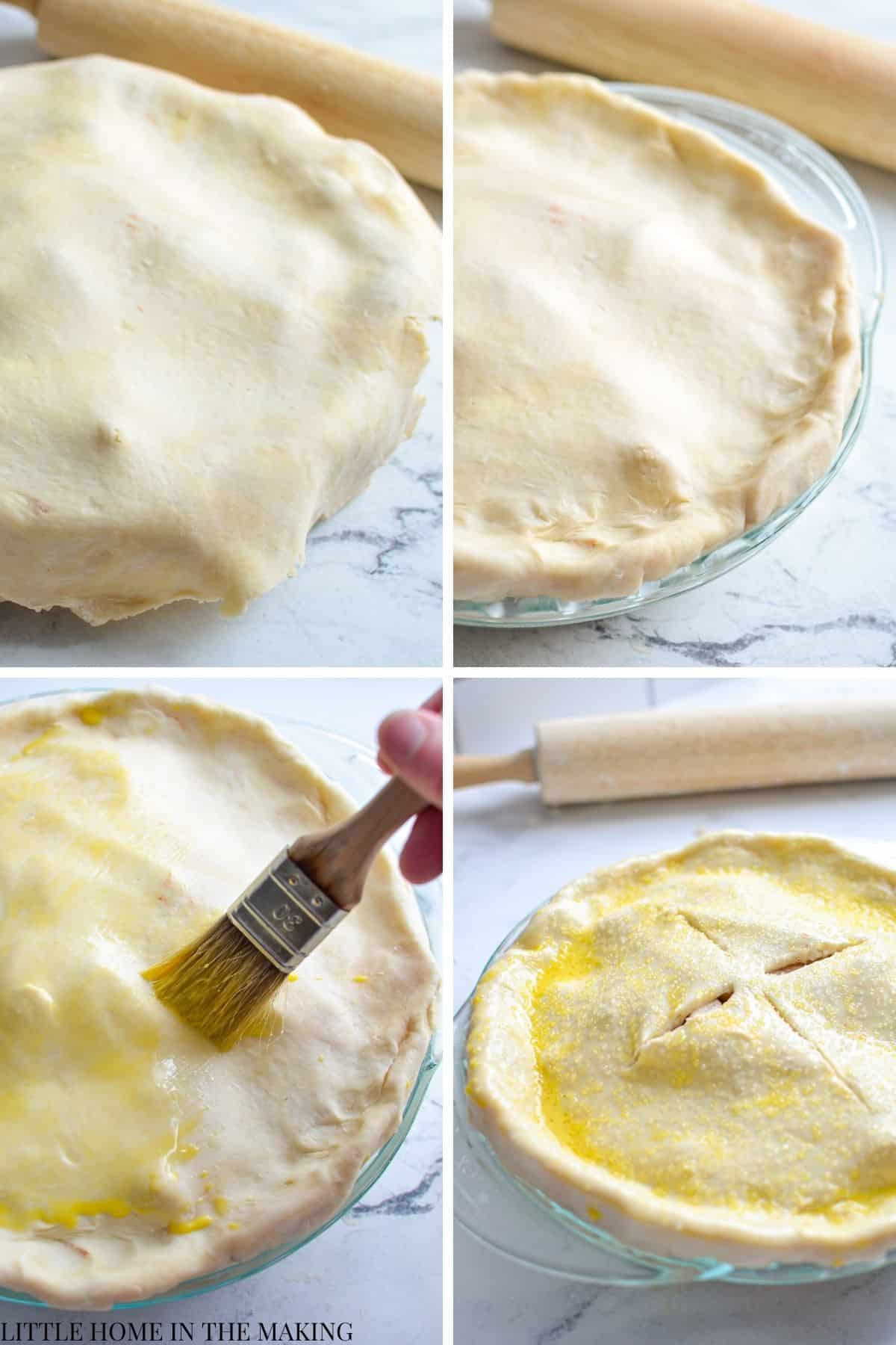 Topping a pie dish with a top crust, and brushing with an egg wash.